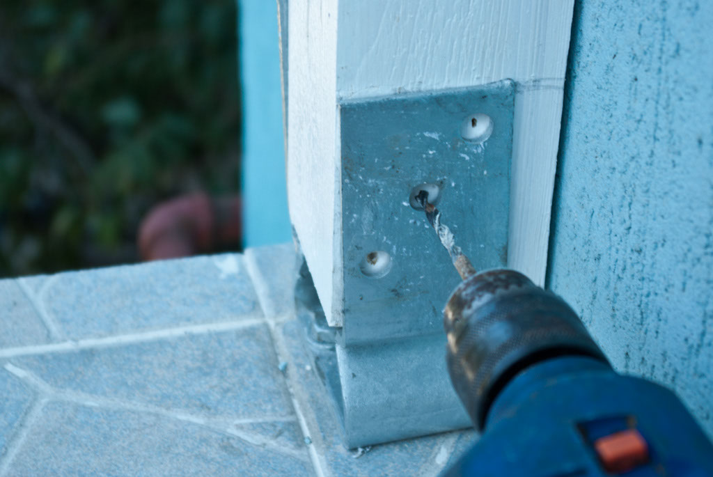 Drilling pilot holes in the post