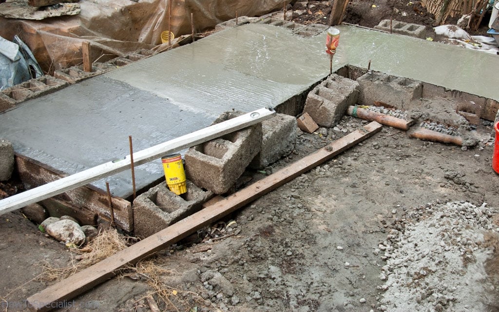 Pouring concrete in the foundation formwork