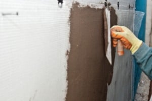 Installing fiberglass net over polystyrene