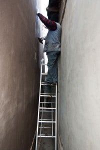 Using a folding ladder to finish polystyrene insulation