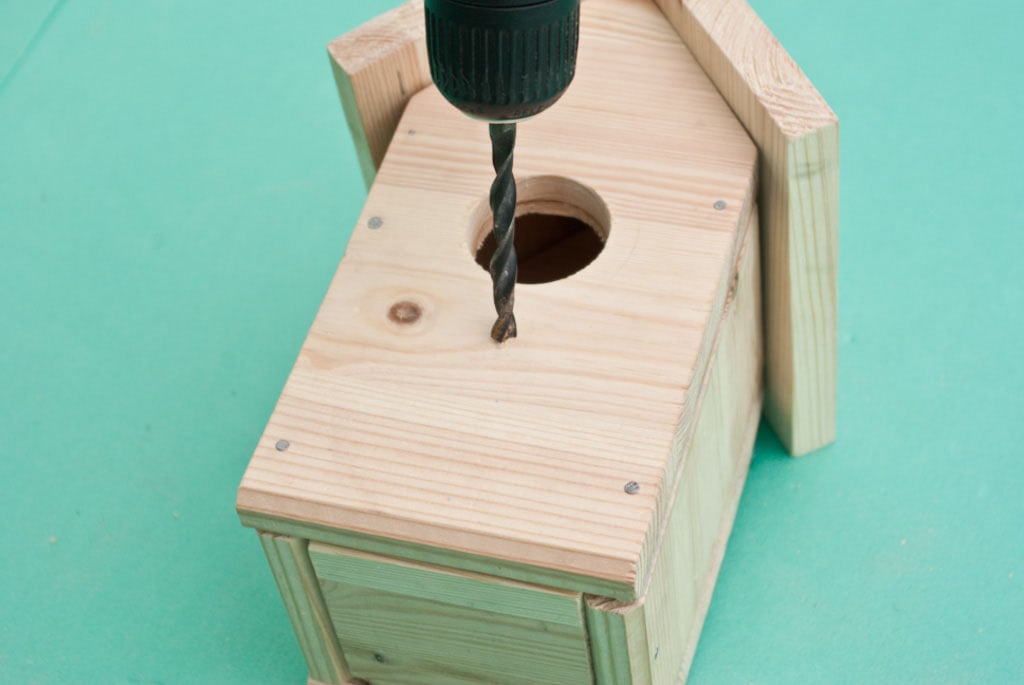 Drilling hole in the bird house