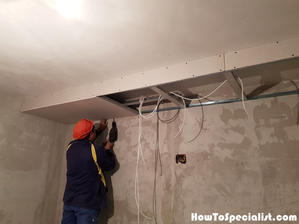 Fitting-the-drywall-sheets-to-the-frame-of-the-soffit-box