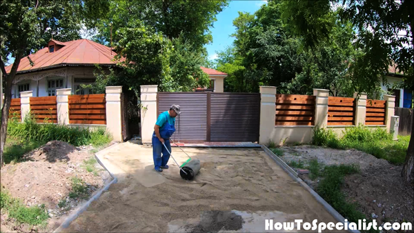 Compacting-the-sand-layer---driveway-project