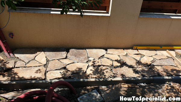 Installing-the-flag-stone-to-the-garden-path