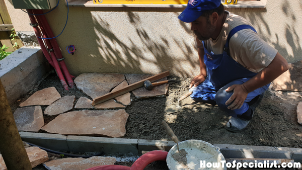 Installing-the-flag-stones-to-the-garden-path