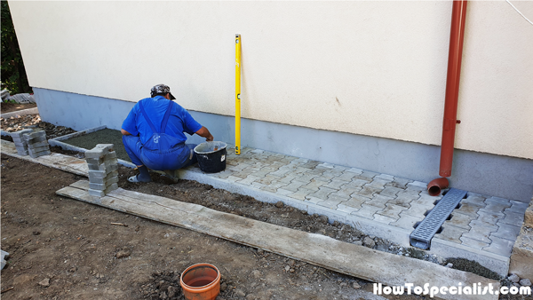 Installing-chanel-drains-to-house-walkways