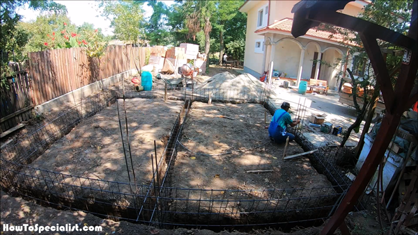 Fitting-the-rebar-beams-into-the-foundation-trenches