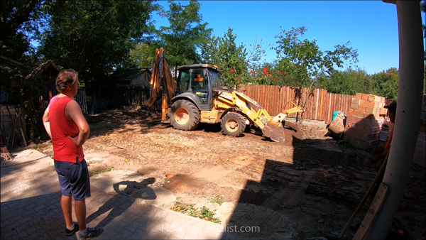 Leveling-ground-with-a-backhoe