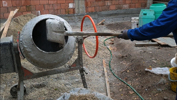 Loading-the-concrete-mixer-with-cement