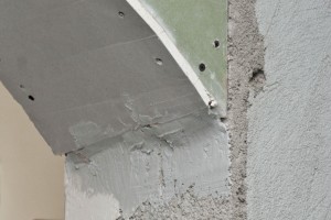 Aplying drywall mud to drywall arch joints