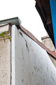 Install polystyrene sheets on concrete wall