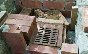 Continuing installing the bricks in the stove firebox