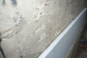 Installing polystyrene to concrete walls