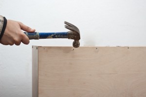 Installing plywood on the back of the show rack