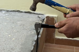 Tapping the chisel with a hammer