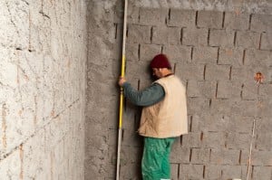 Making sure the plaster is plumb