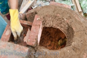 Laying the top of the pizza oven dome