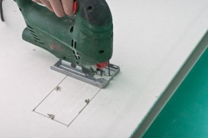 Cutting square hole in drywall with jigsaw