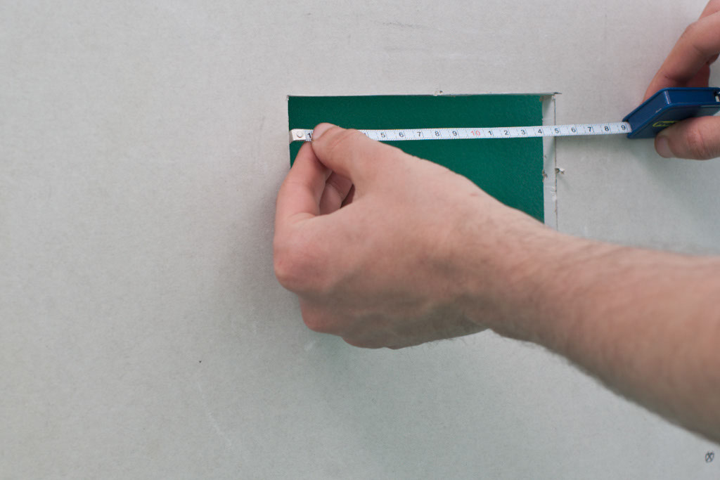 Measuring hole in drywall