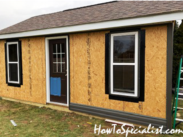 Adding-the-siding-to-the-barn-shed