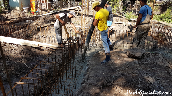 Pouring-concrete-into-foundation-trenches